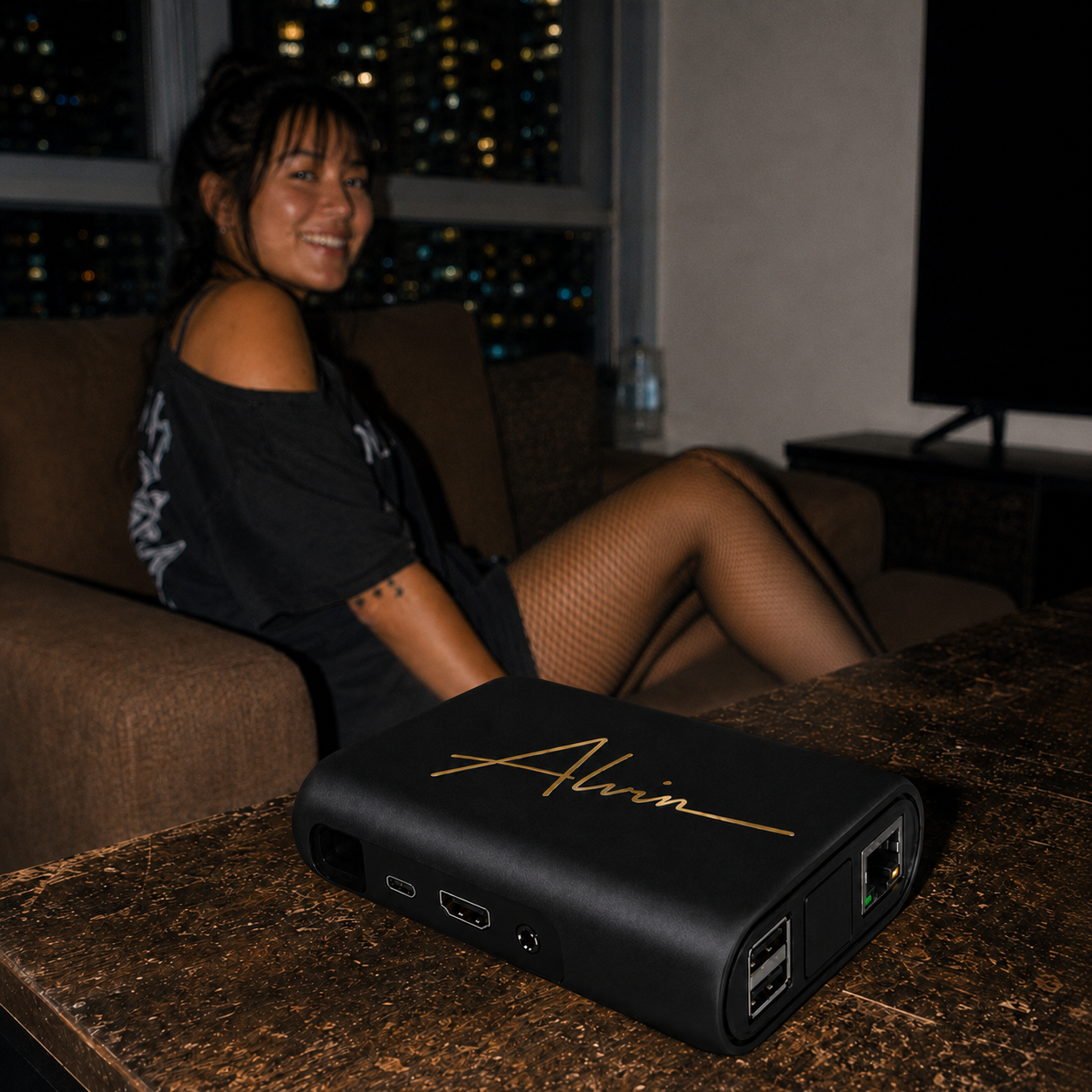 Woman holding the compact ALVIN adult streaming device