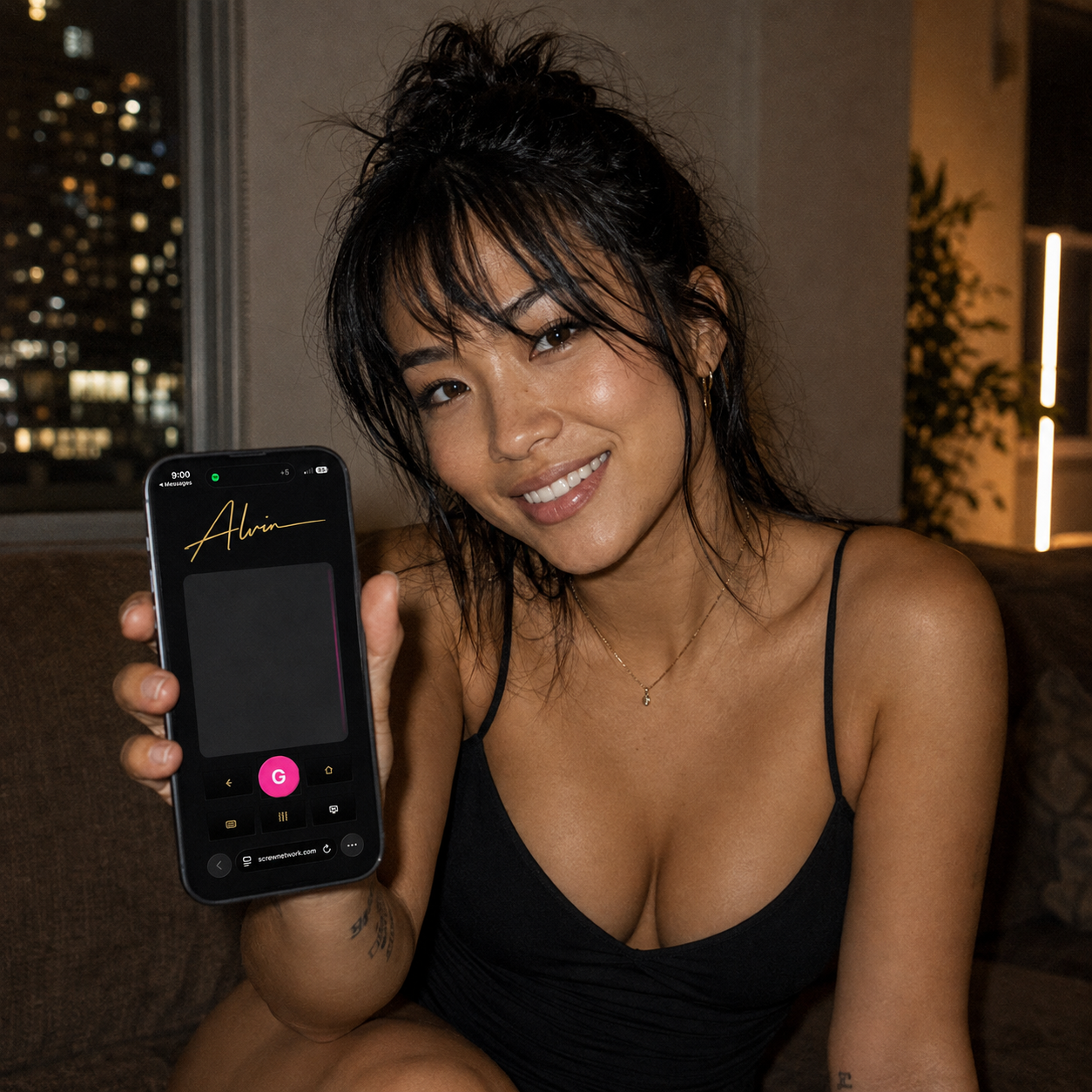 Woman holding a phone displaying the ALVIN Type and Swipe remote app